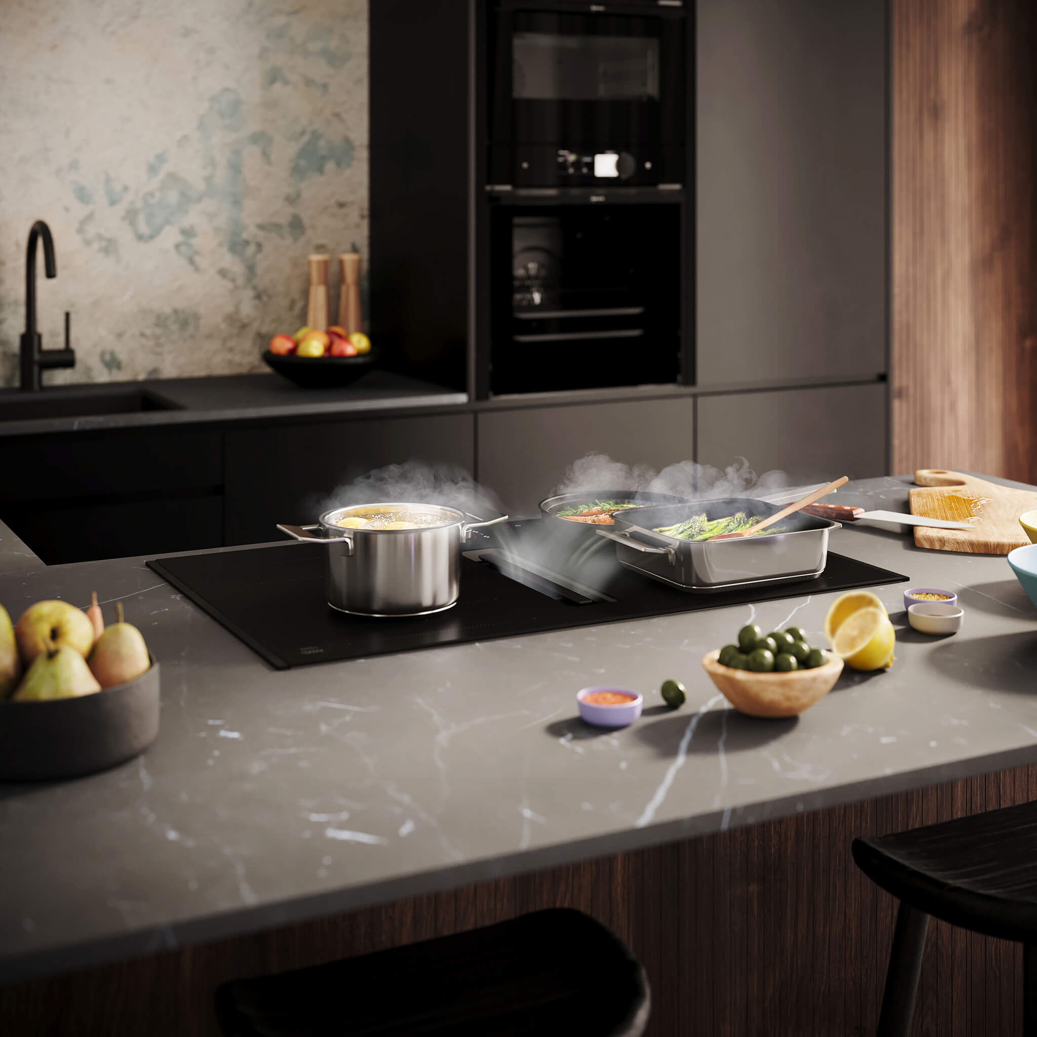 Inductiekookplaat van NEFF met afzuiging in matzwart, geïntegreerd in een moderne keuken.