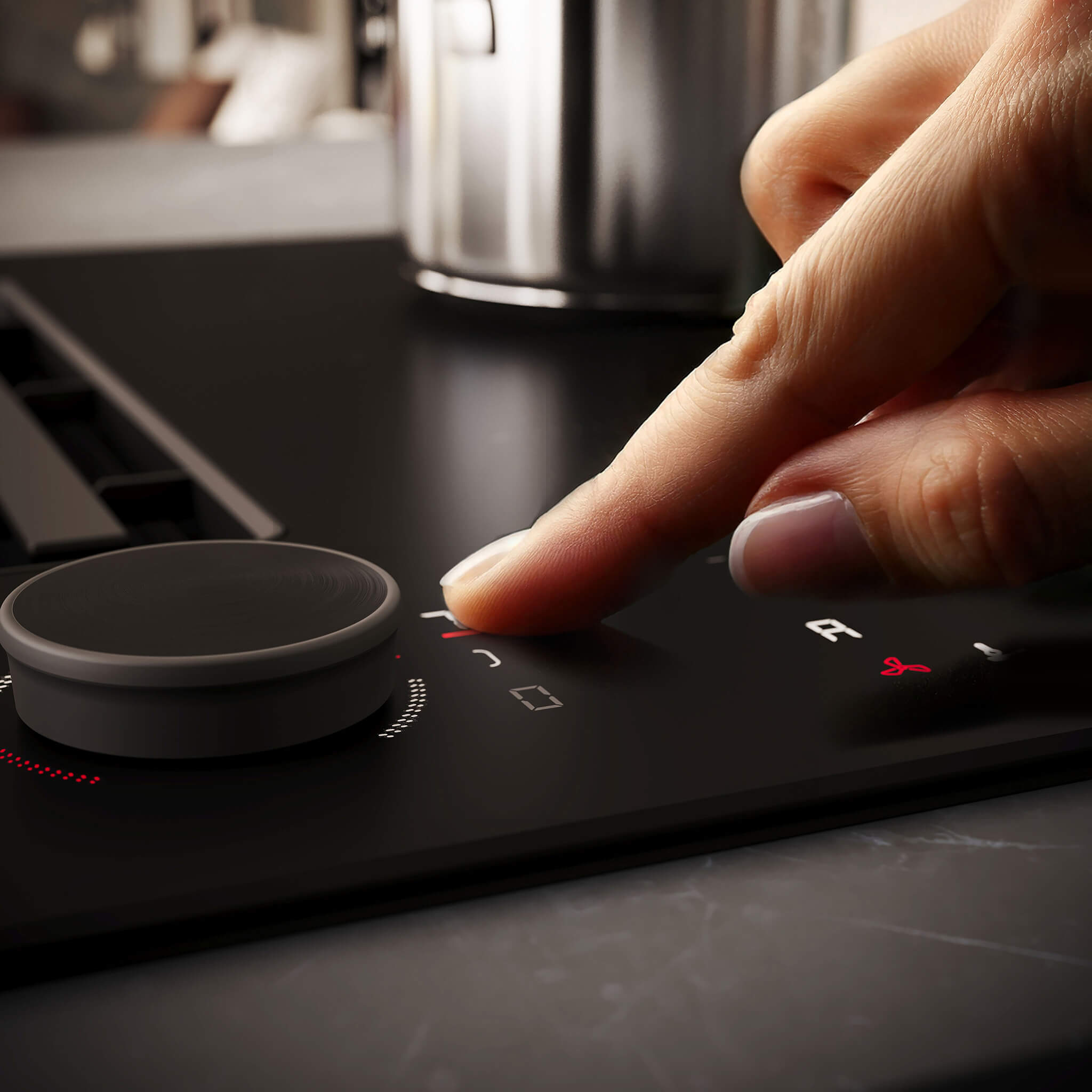 Hand die NEFF kookplaat bedient met de afneembare Twist Pad Flex® knop.